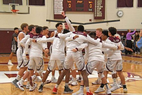 TRADITON NEVER GRADUATES
The Slaters get hyped before a big contest. They would go on to win this game 69-55