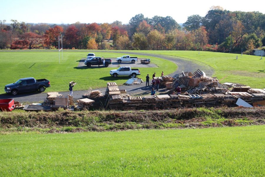 WHAT A VIEW!
Dedicated seniors work together moving pallets to build an enormous bonfire