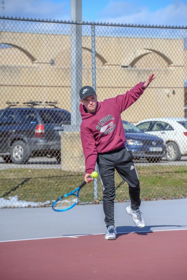SOARIN’! Senior Brayden Beltrano is seconds away from hitting a nice forehand in a rally. 