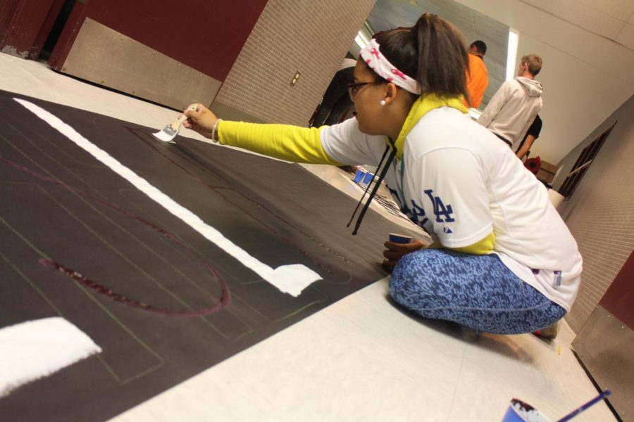WORK WORK AND MORE WORK!
Senior Liv Groller contributes her time making a poster.
