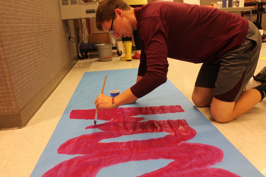HERE COMES THE BOOM!
Senior Colby Toth focuses on making a great poster.