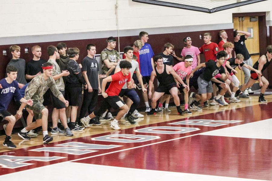 OFF TO THE RACES!-Bangor High School dodgeball students viciously attacks the line in the opening run to start game.
