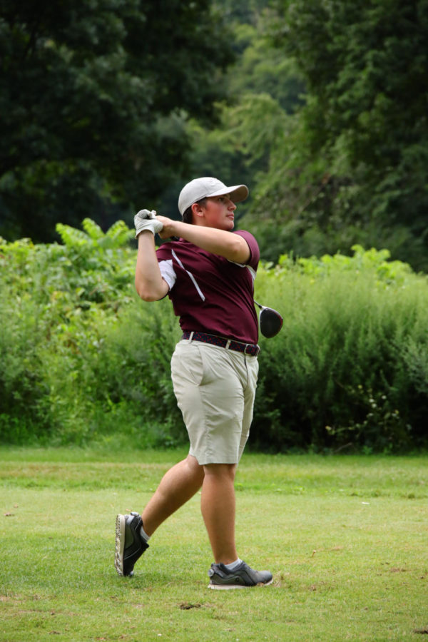SWINGING FOR THE STARS! Junior Freddy Bacon effortlessly displays his trustworthy drive as he launches the golf ball across the course.  After a regular season full of success, Bacon took his winning swing to the Colonial League Tournament and earned himself sixth place.  