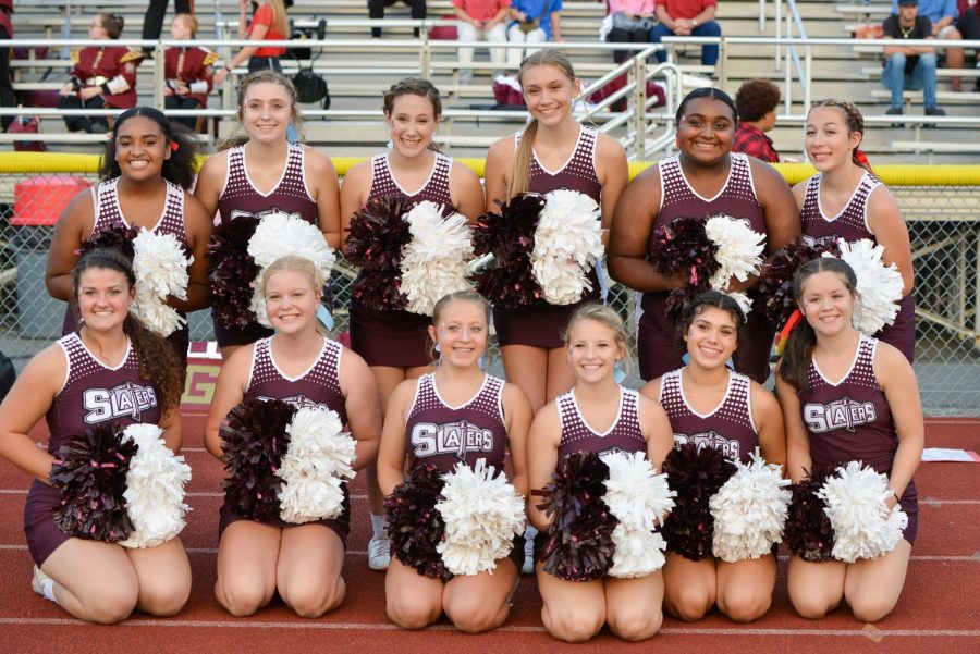 ONE TEAM, ONE DREAM! The BAHS cheer squad poses for a team pic before cheering at the big homecoming game. After attending only home games through the 2020-2021 season, this squad was pumped to show their skills at every contest this year.