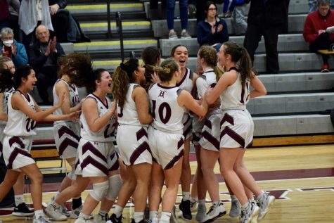 TIME TO CELEBRATE! The Lady Slaters huddle together after a historic state playoff win. They were the only team at Bangor to win a home playoff game; they finished their season with a 19-9 record. 