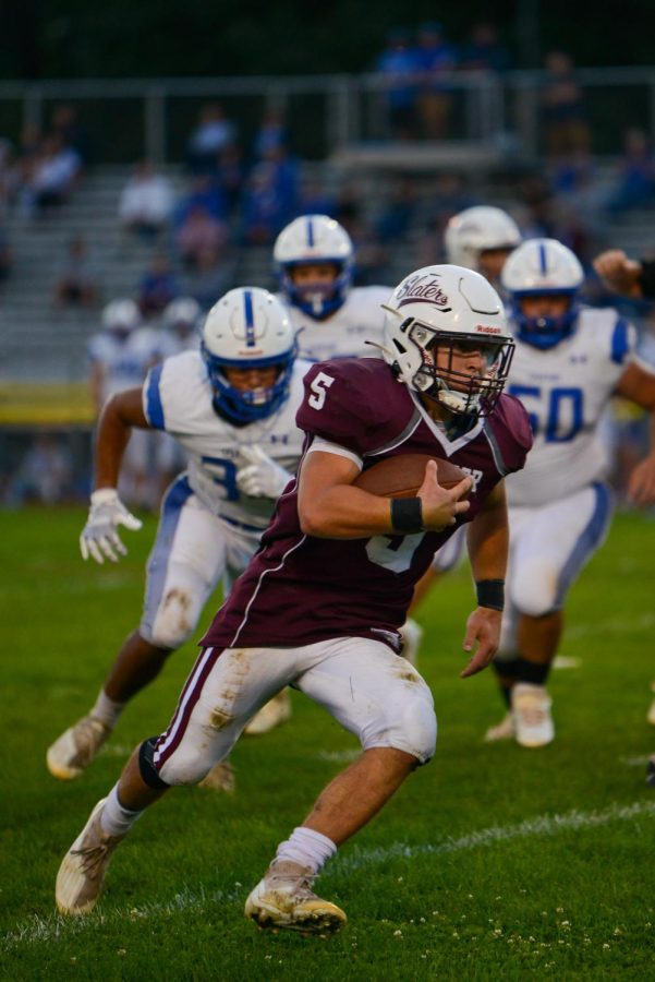 CAN’T CATCH KAEL! Senior captain Kael Godshalk moves swiftly past the Southern Lehigh defense in the annual Homecoming game. Godshalk finished the game with four touchdowns. 