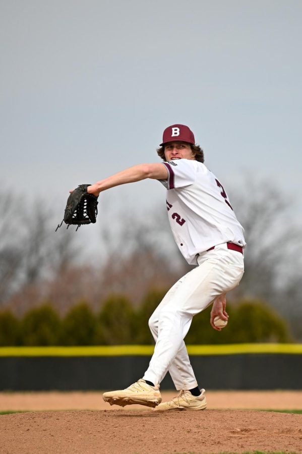 GIVE HIM THE HEATER! Senior pitcher Hunter Rydell winds up the pitch.