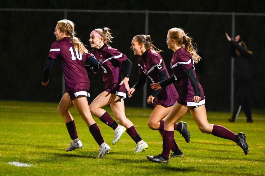 FUN TIMES! Bangor Slaters Girls Soccer team celebrates after scoring a goal.
