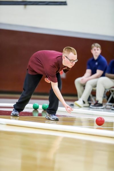 ROLLING WITH PRECISION
Senior Devil Howell skillfully rolls the bocce ball to get as close to the pallino as possible