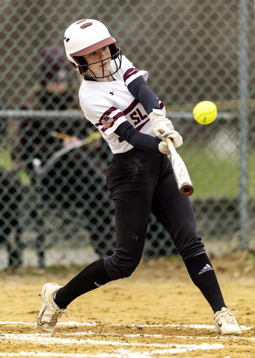 SWING SENSATION
Sophomore Kelli Snow makes a decisive swing at the softball, demonstrating her skill and precision at the plate during a match.