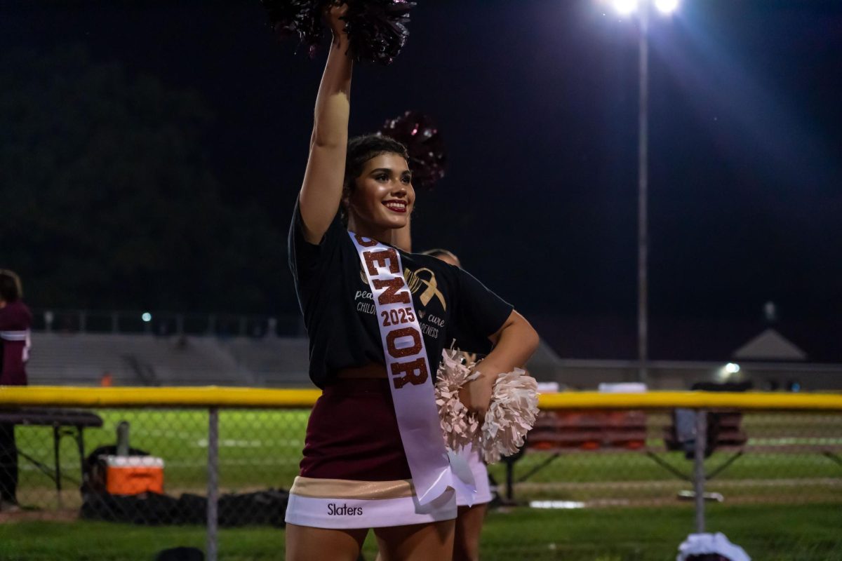 SENIOR NIGHT SHINE Senior Maria Leszkowicz shines bright on her senior night finishing the night with her memorable school spirit and passion towards cheering and the football team.