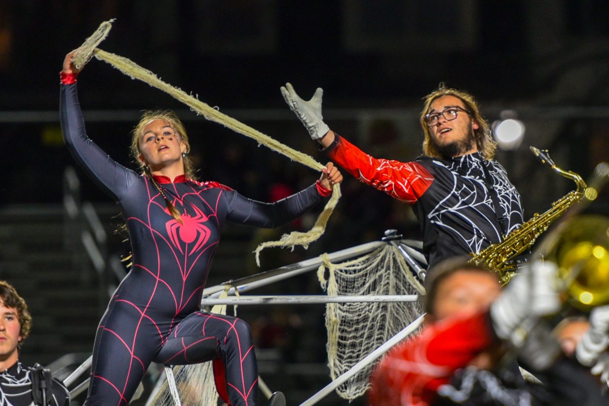 WOVEN WITH PRIDE! Carly Merklin and Chase Begor don their spider outfits for the marching band's "The Webs We Weave."